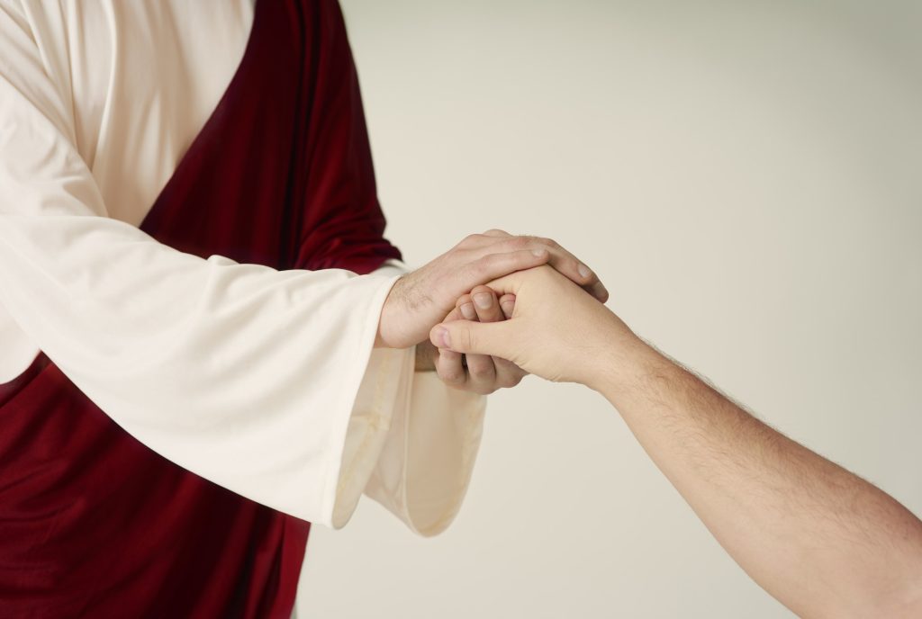 Jesus hand rescue and reaching humans one