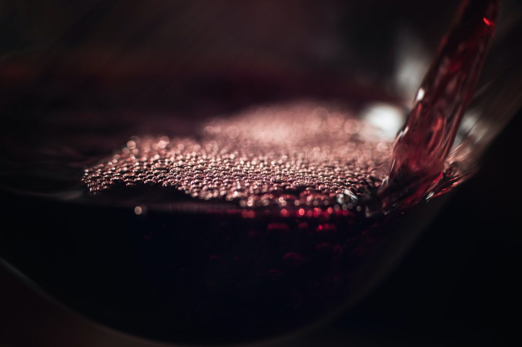 Red Wine Pouring Into Wine Glass