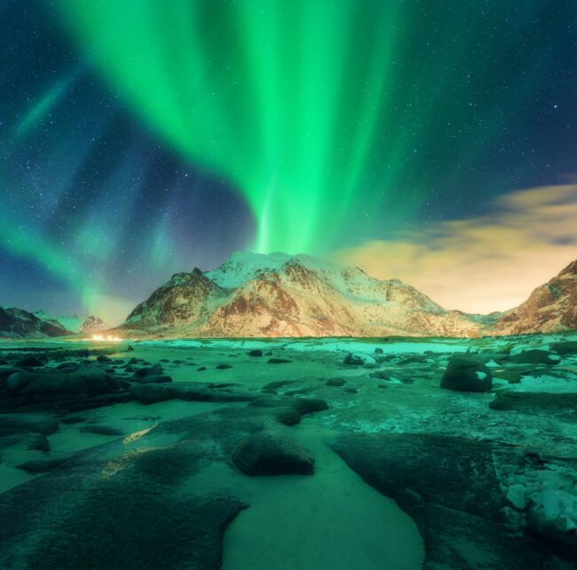 Aurora over snowy mountains. Northern lights Aurora over snowy mountains. Northern lights